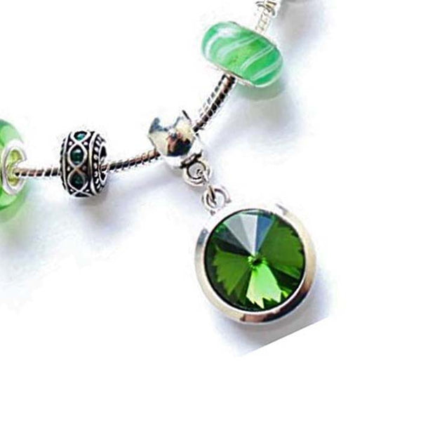 Close up of adults May Birthstone bracelet
